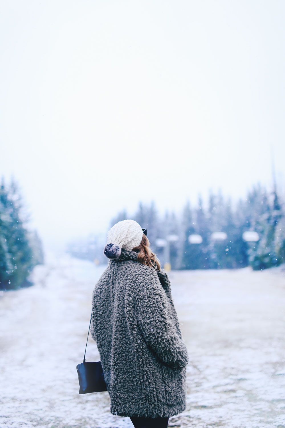 Whistler travel guide at the Fairmont Chateau Whistler with To Vogue or Bust in an Aritzia teddy coat, Hudson black skinny jeans, Joe Fresh snow boots, Tilley Hats beanie and Aritzia black leather bag