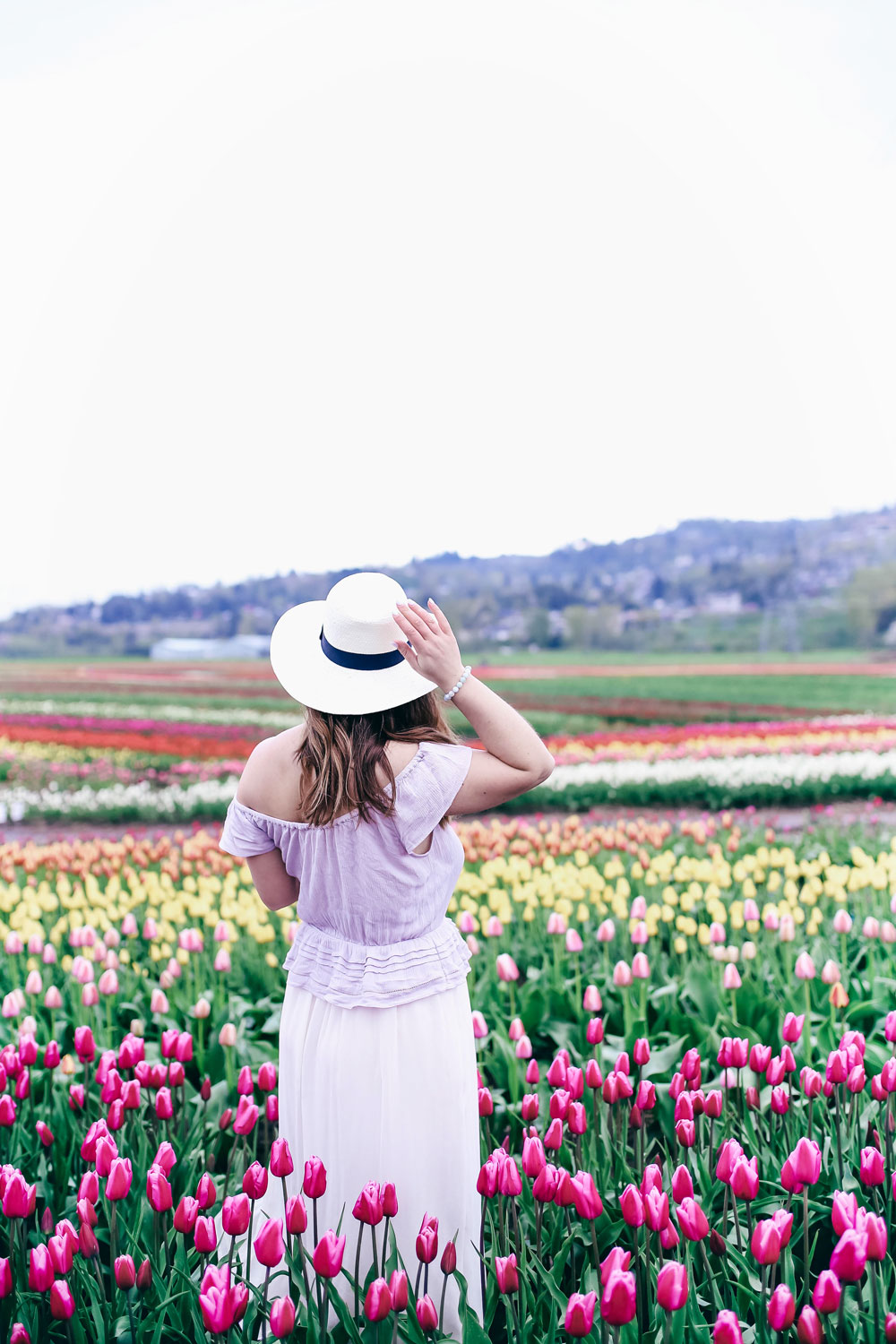 Tulip fields in Vancouver by To Vogue or Bust in an Aritzia silk skirt Aritzia off the shoulder top Joe Fresh panama hat