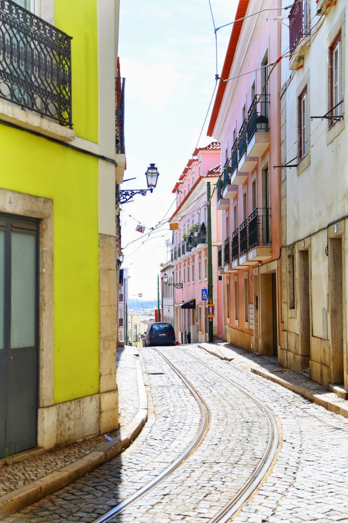 alfama tram lisbon by To Vogue or Bust