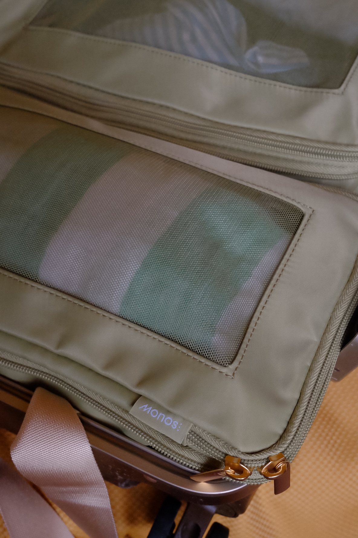 Close-up of the Monos suitcase and packing cubes.